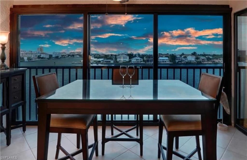 a view of a room with a table and chairs