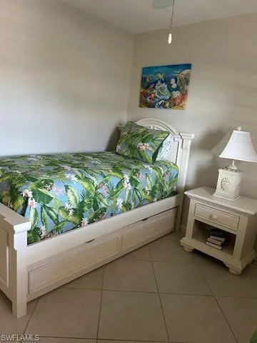 a view of a room with furniture and a bathtub