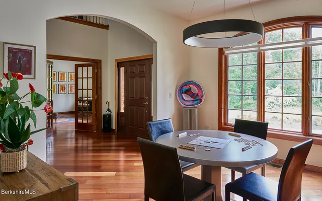 a view of a dining room with furniture window and wooden floor