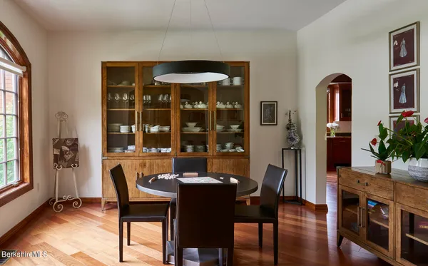 a view of a dining room with furniture and window