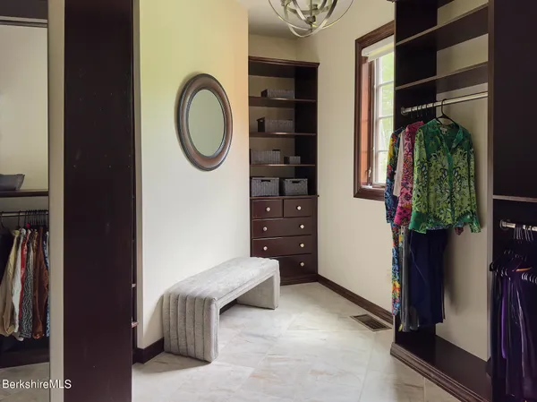 a bedroom with furniture and a window