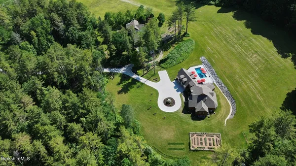 an aerial view of a golf course with parking space