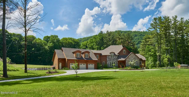 a picture of a room with a white comforter