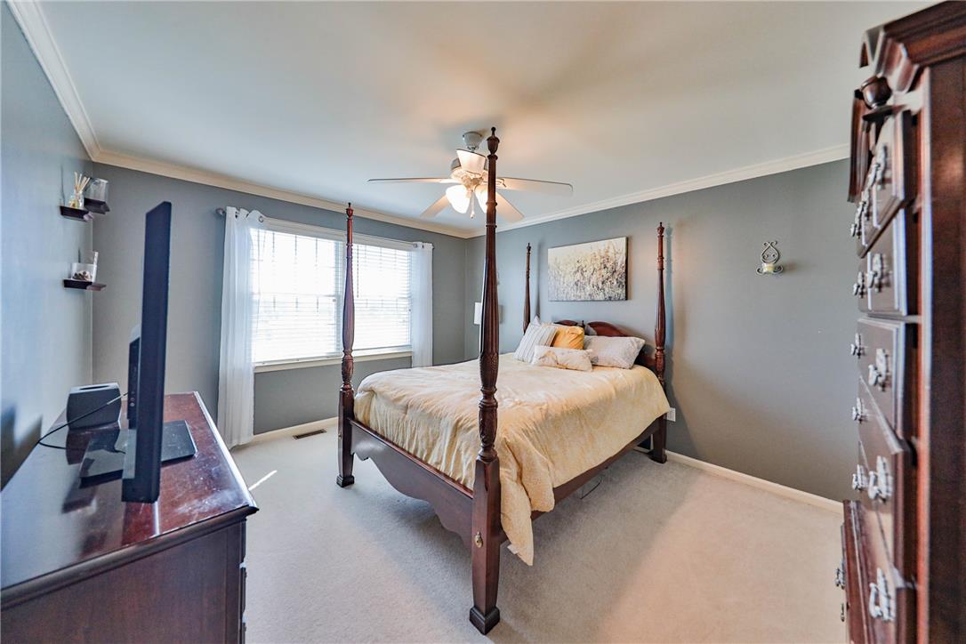 63 Long Road Lenhartsville, PA 19534 - Photo 73 of 100 Plush carpet flooring and elegant crown molding define this comfortable, well-lit bedroom.
