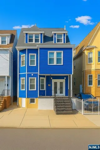 a view of a brick building with many windows