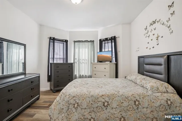 a bedroom with a bed and a dresser