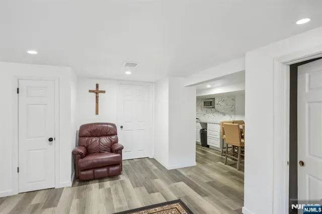 a room with furniture and wooden floor