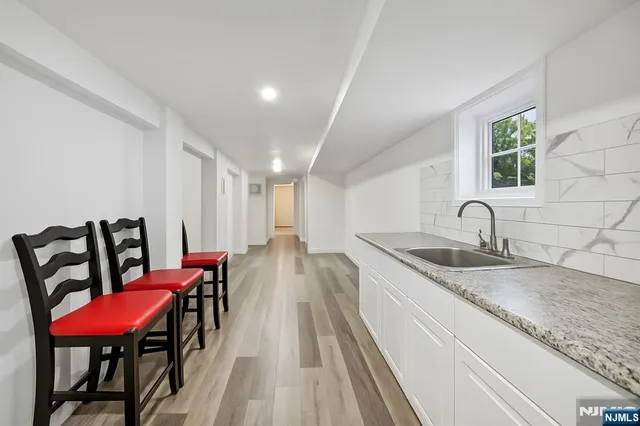 a view of a kitchen area with furniture and a table