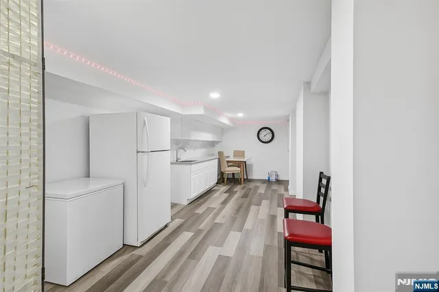 a view of kitchen and wooden floor