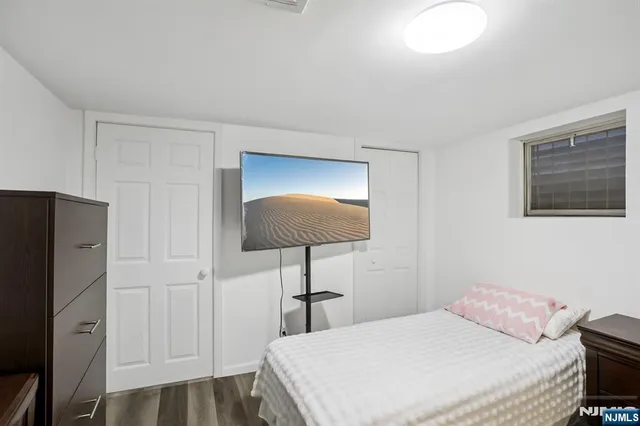 a bedroom with a bed and a lamp