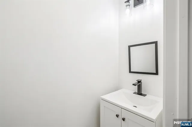 a bathroom with a sink and vanity