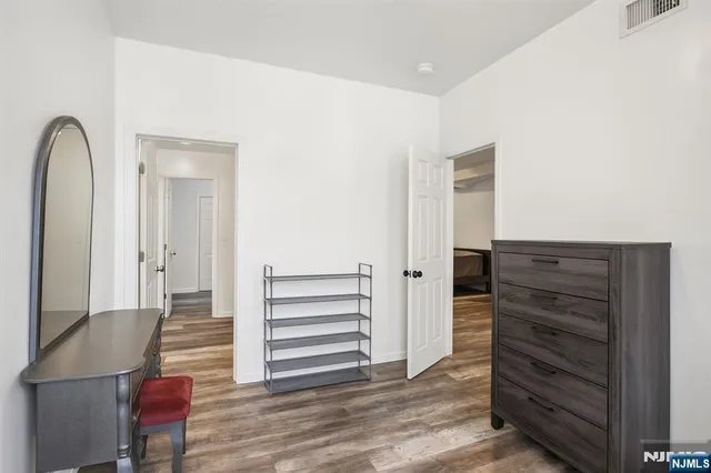 a bedroom with a bed and the wall painting