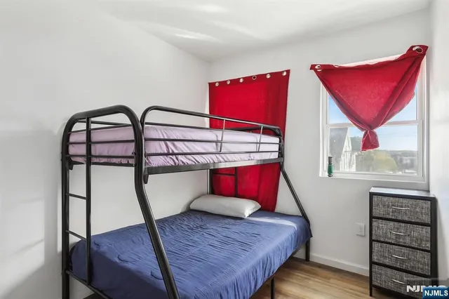 a bathroom with a toilet and a window