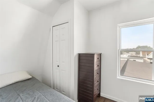 a living room with a couch and a table with wooden floor