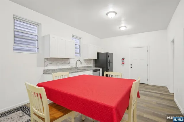 a view of a dining room with furniture and a table