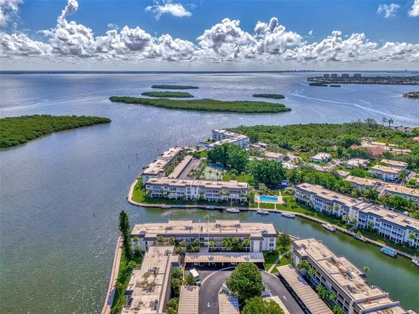 an aerial view of a house with a ocean view