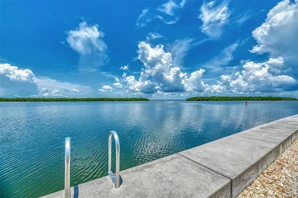 a view of a swimming pool with a table and chairs