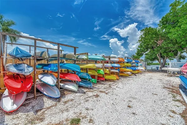 a front view of a house with a yard table and chairs