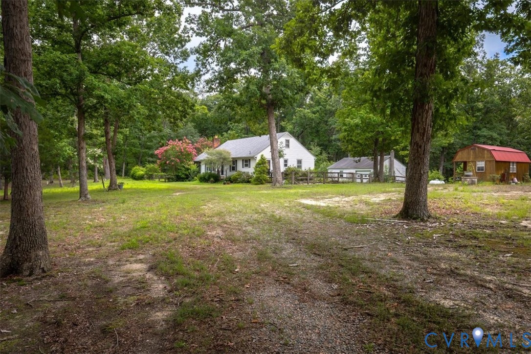 20101 River Road Chesterfield, VA 23838 - Photo 4 of 44 White residence with a front porch, featuring a gr
