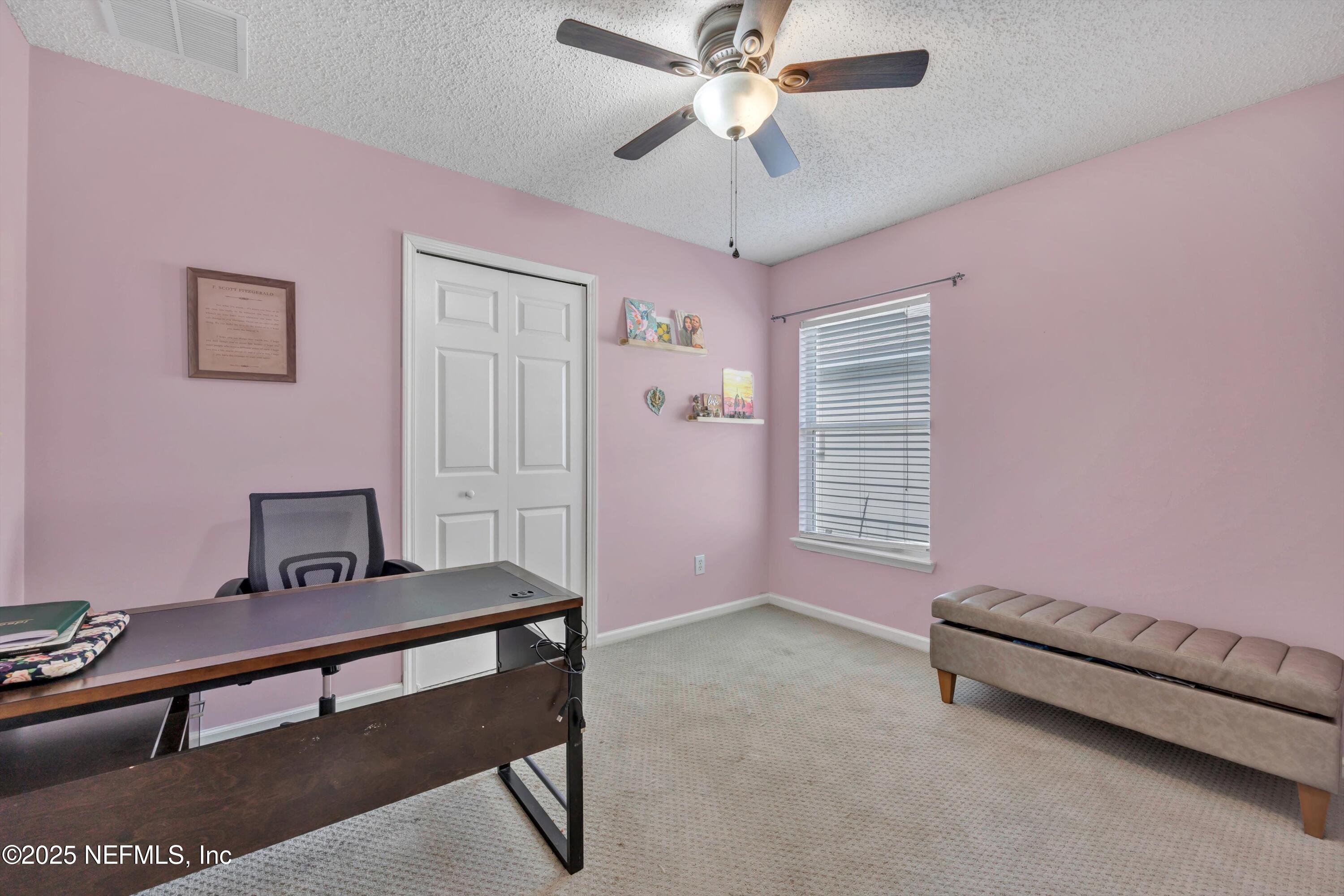 1374 Brookgreen Way Fleming Island, FL 32003 - Photo 11 of 21 a bedroom with furniture and a window