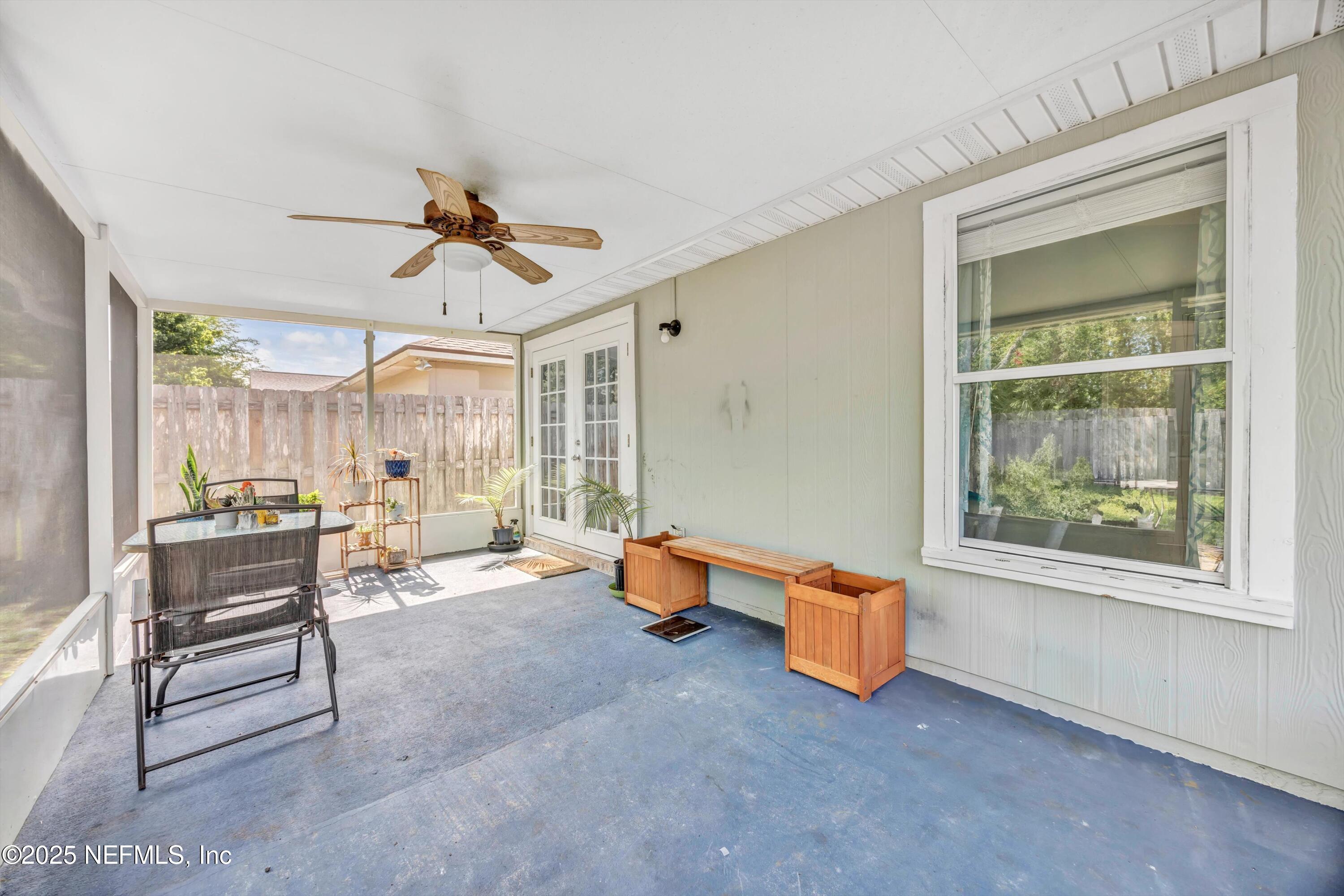 1374 Brookgreen Way Fleming Island, FL 32003 - Photo 13 of 21 a living room with furniture and a window