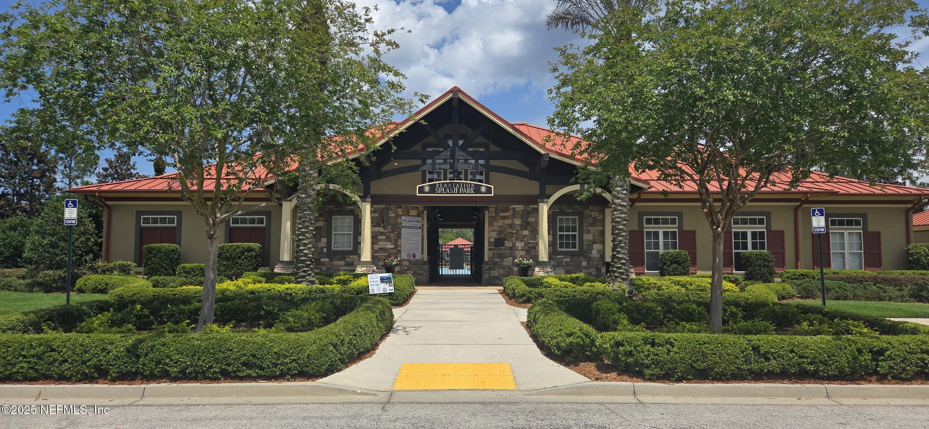 1374 Brookgreen Way Fleming Island, FL 32003 - Photo 15 of 21 a front view of a house with yard and green space