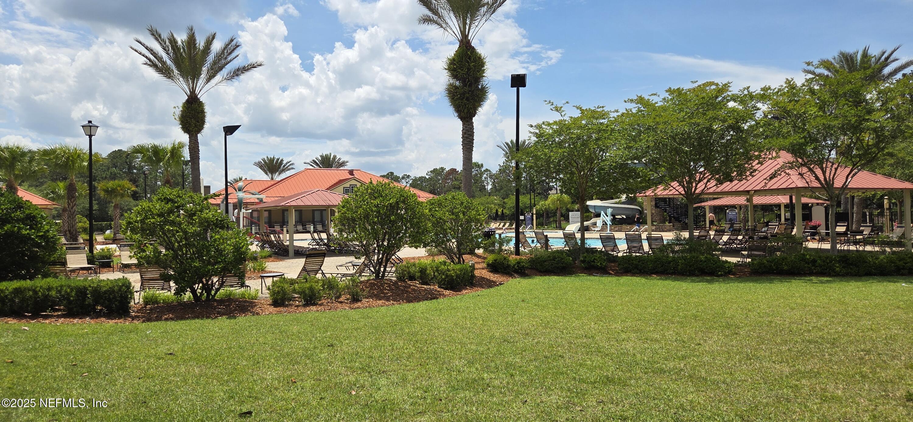 1374 Brookgreen Way Fleming Island, FL 32003 - Photo 17 of 21 a front view of a house with garden
