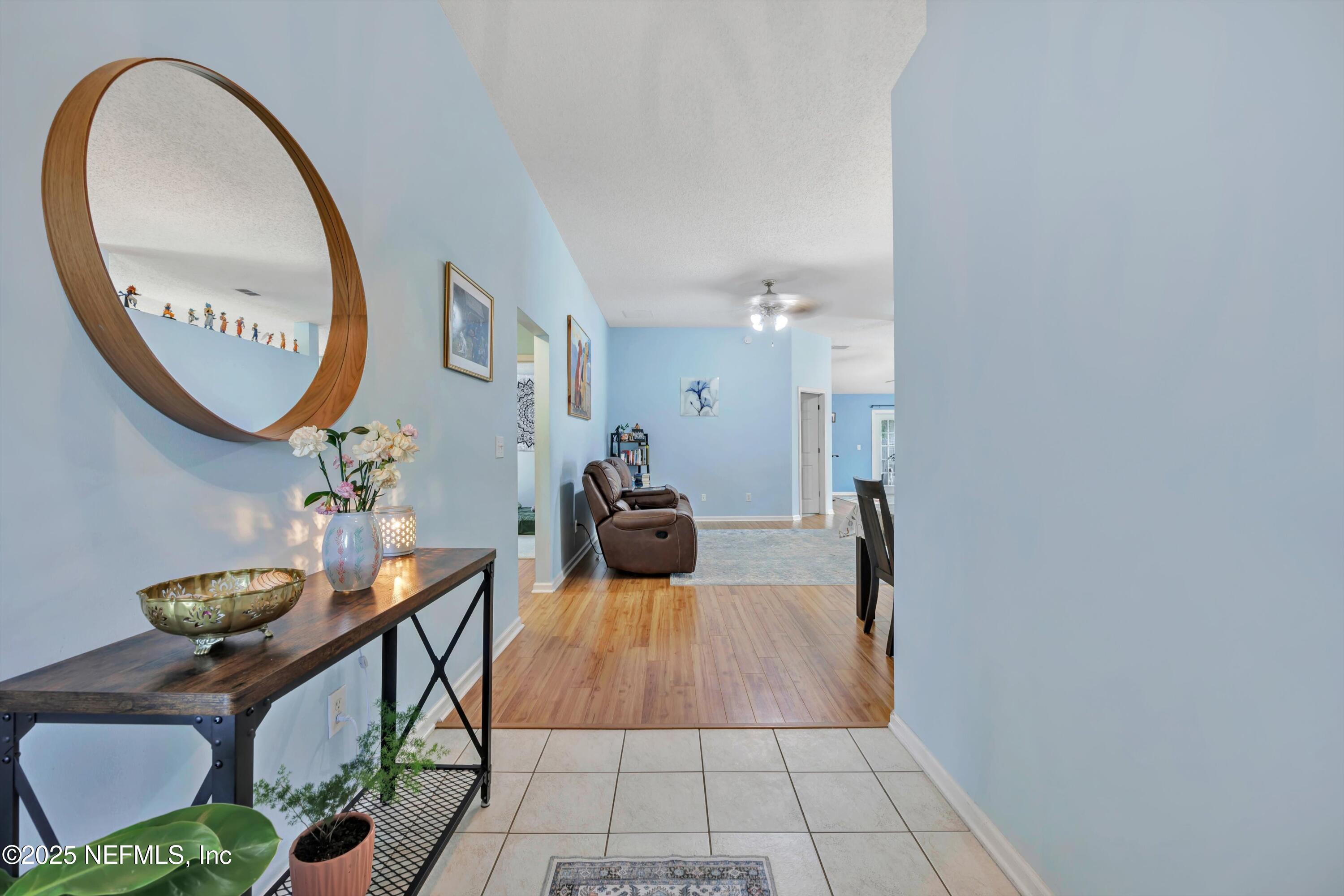 1374 Brookgreen Way Fleming Island, FL 32003 - Photo 19 of 21 a very nice looking room with a large mirror and a table