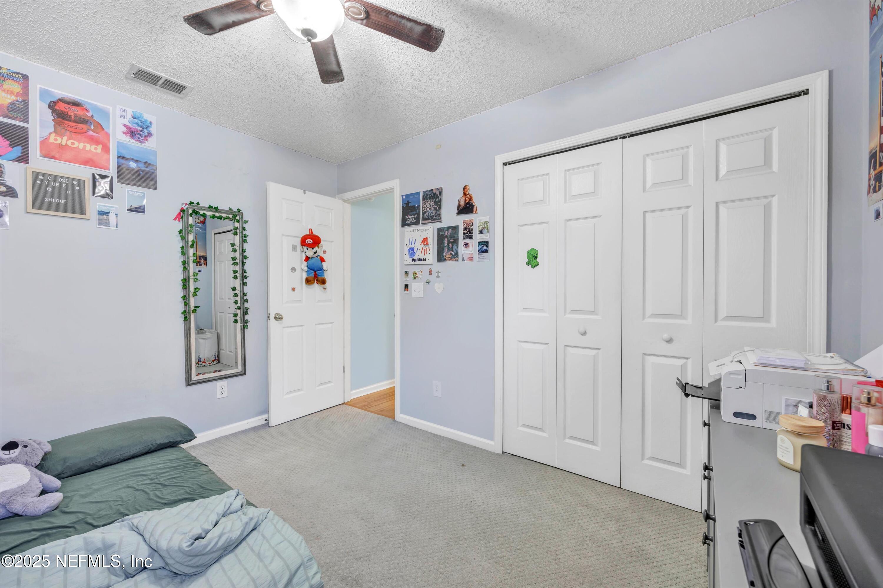 1374 Brookgreen Way Fleming Island, FL 32003 - Photo 20 of 21 a living room with furniture and a window