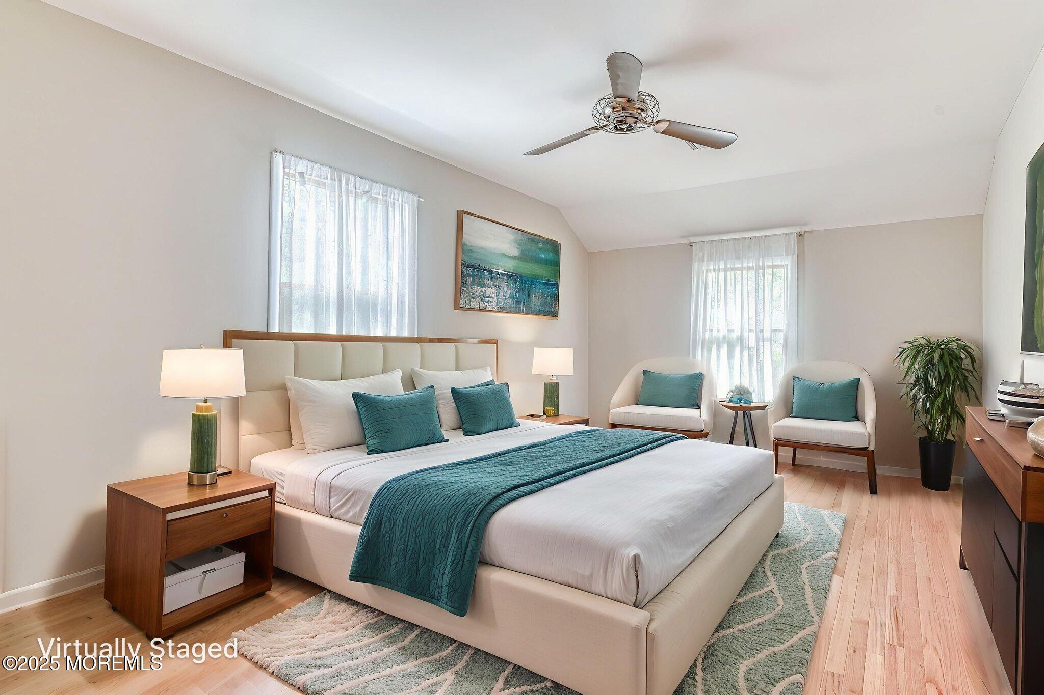 24 Peach Tree Road Oakhurst, NJ 07755 - Photo 13 of 34 a bedroom with bed and a couch