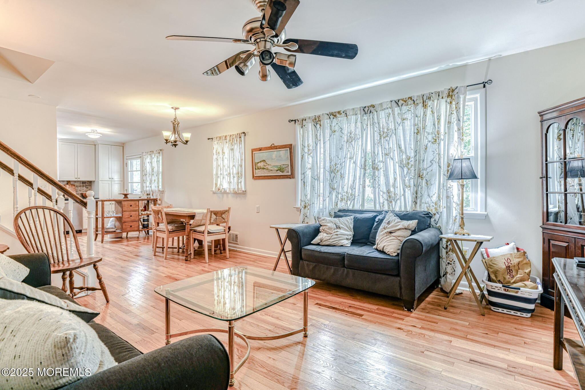 24 Peach Tree Road Oakhurst, NJ 07755 - Photo 21 of 34 a living room with furniture and a large window