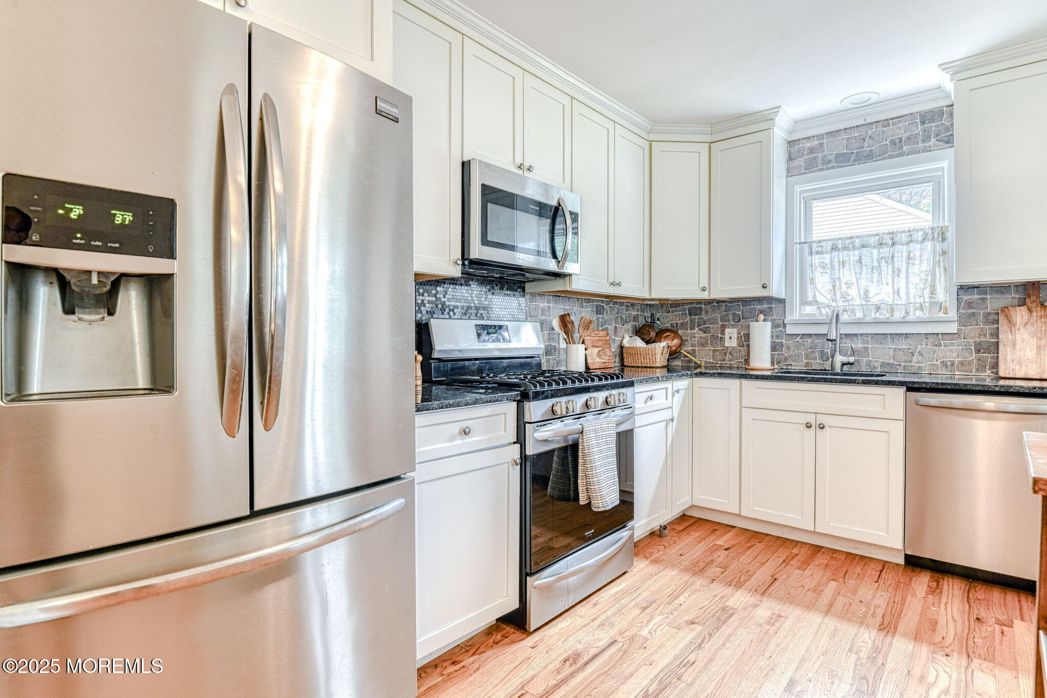 24 Peach Tree Road Oakhurst, NJ 07755 - Photo 25 of 34 a kitchen with stainless steel appliances granite countertop a refrigerator sink and microwave