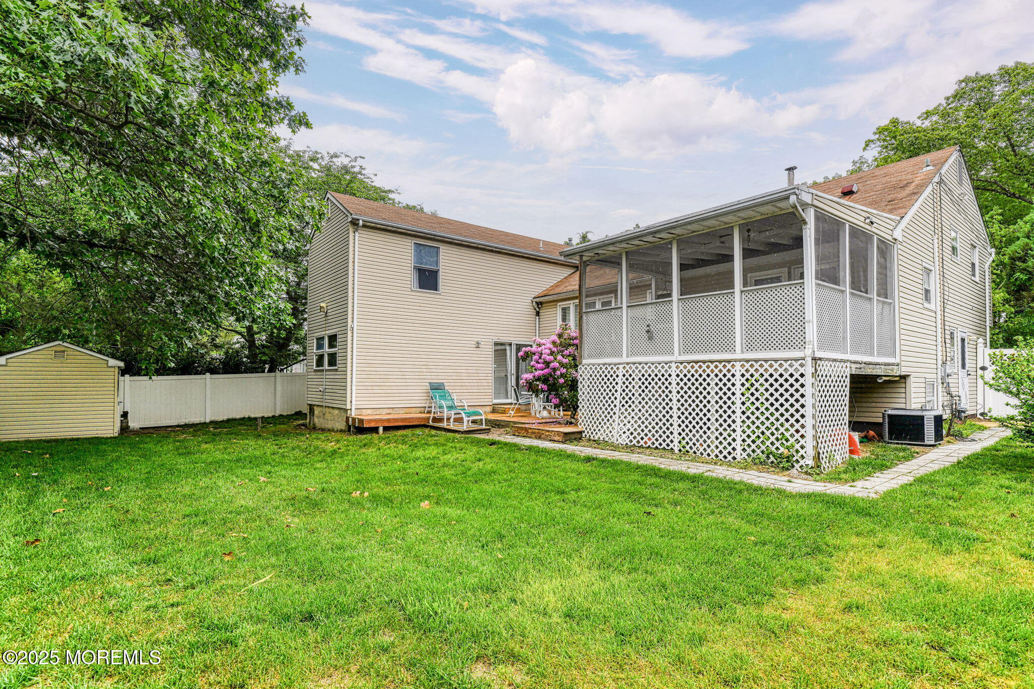 24 Peach Tree Road Oakhurst, NJ 07755 - Photo 32 of 34 a view of a house with a yard