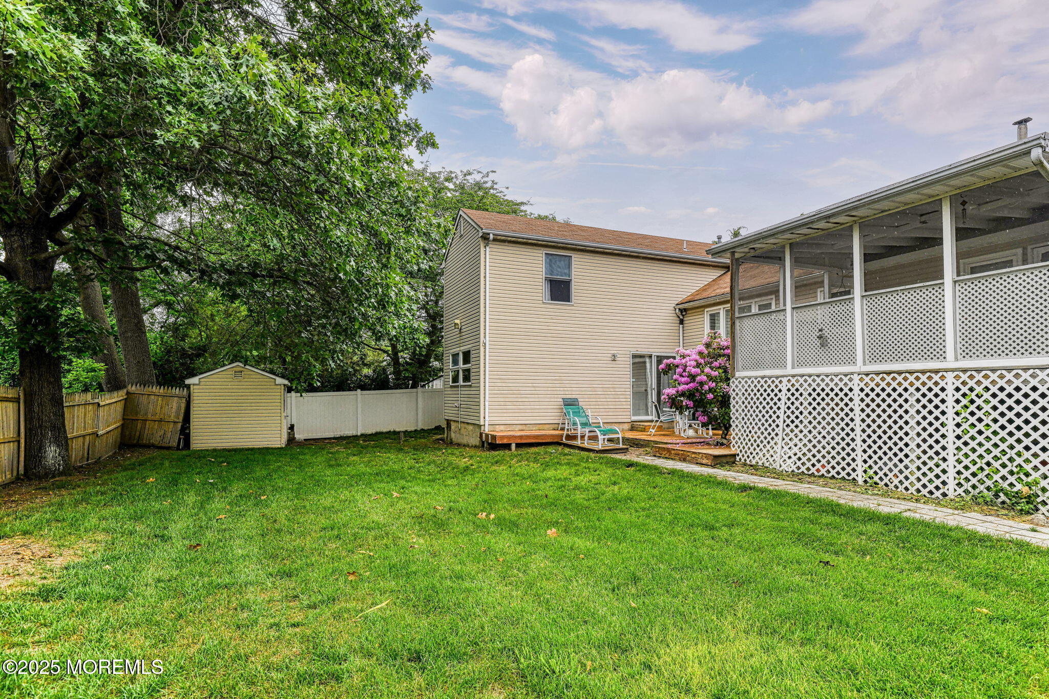 24 Peach Tree Road Oakhurst, NJ 07755 - Photo 33 of 34 a view of a house with a yard and deck