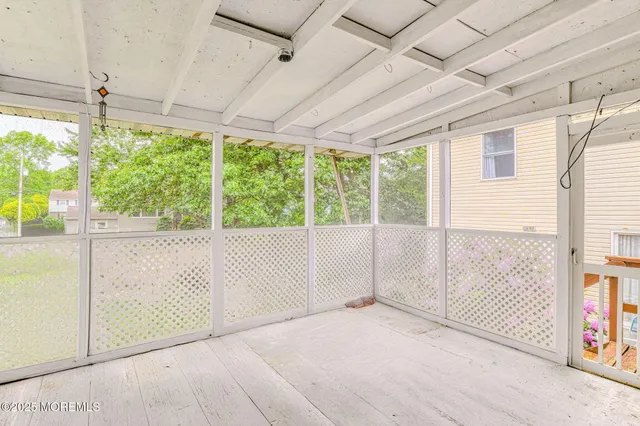 a view of a room with windows