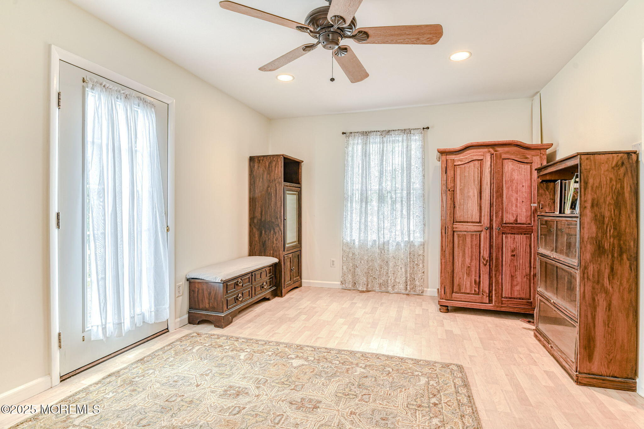 24 Peach Tree Road Oakhurst, NJ 07755 - Photo 7 of 34 a view of a bedroom with furniture and windows