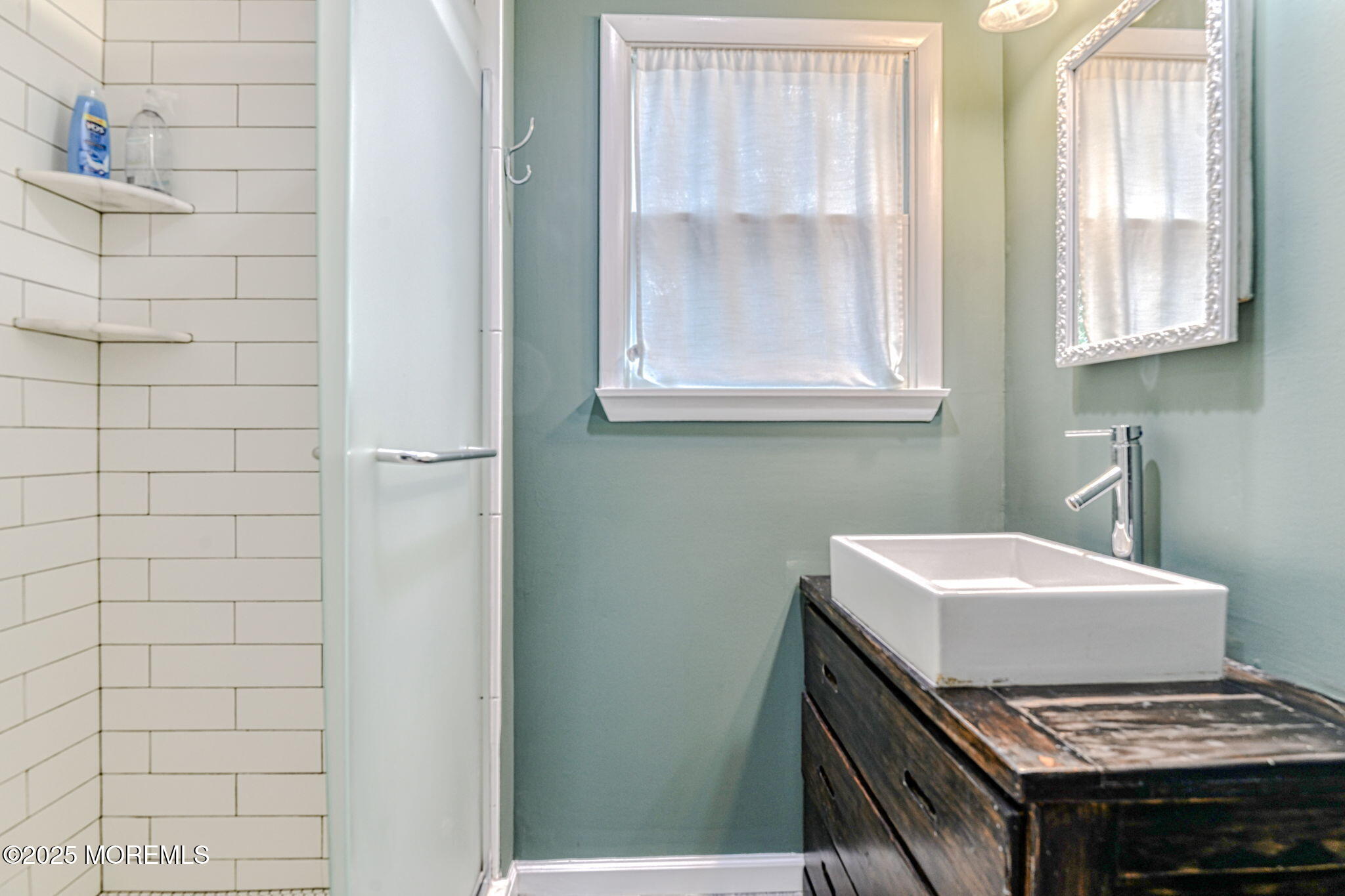 24 Peach Tree Road Oakhurst, NJ 07755 - Photo 8 of 34 a bathroom with a sink and a mirror