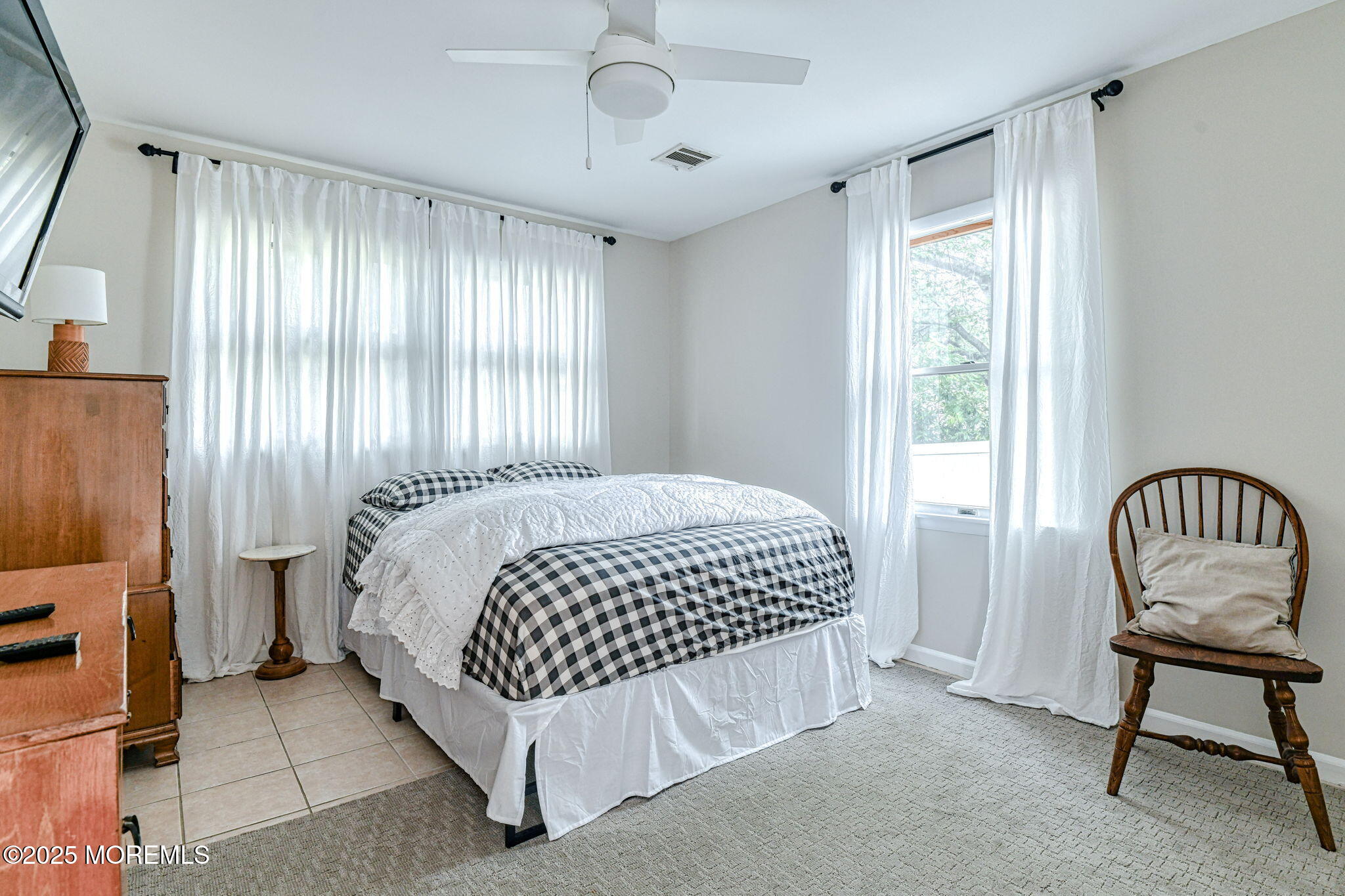 24 Peach Tree Road Oakhurst, NJ 07755 - Photo 9 of 34 a bedroom with a bed and a window