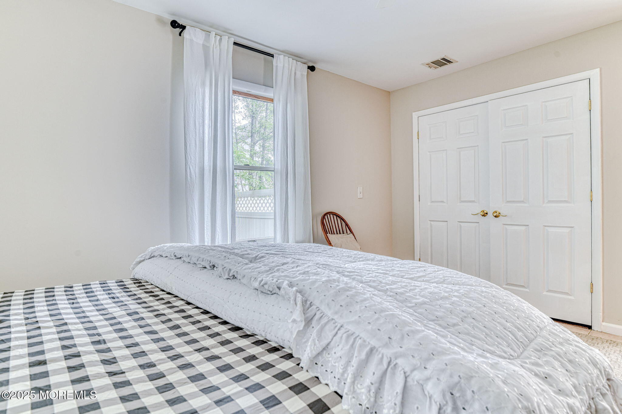 24 Peach Tree Road Oakhurst, NJ 07755 - Photo 10 of 34 a bedroom with a bed and a window