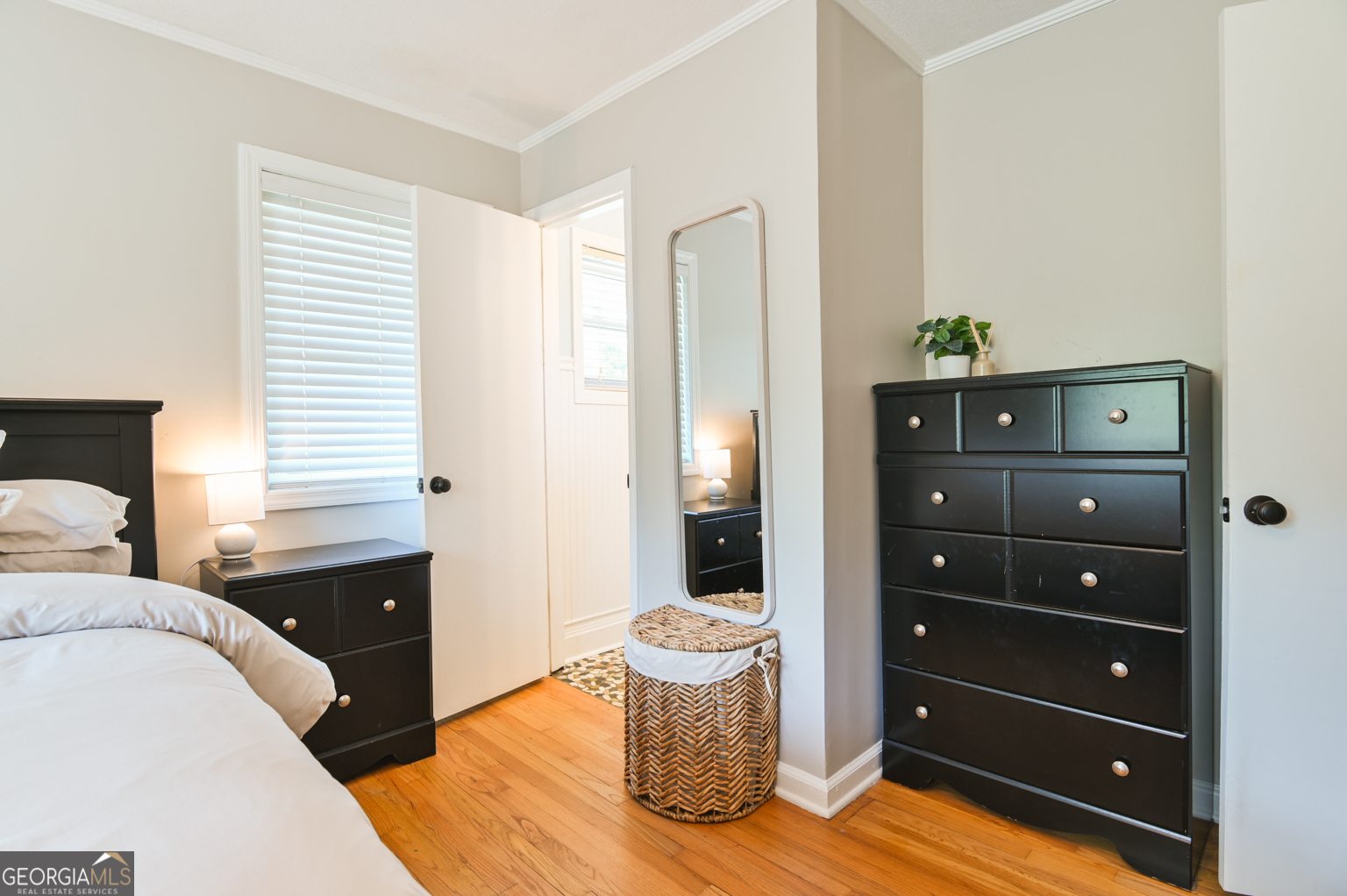 545 Forest Hill Road Macon, GA 31210 - Photo 52 of 63 a bedroom with a bed and a dresser