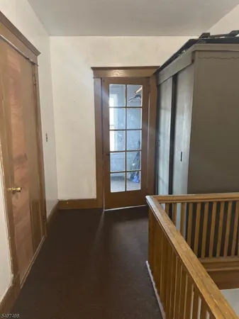 a view of wooden floor and windows in a room