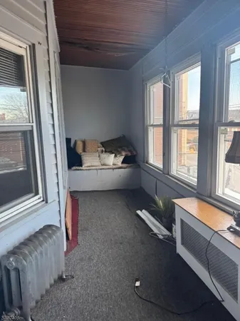 a room with furniture and a window