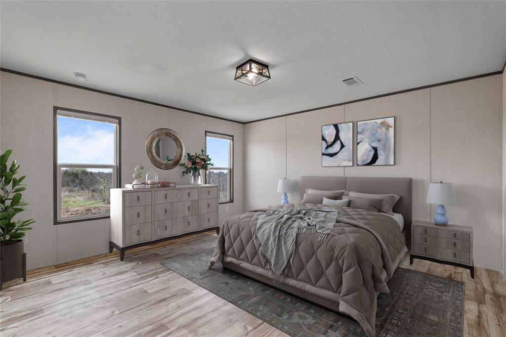 3924 Sandusky Road Whitesboro, TX 76273 - Photo 15 of 22 Bedroom featuring a decorative wall, light wood finished floors, and ornamental molding