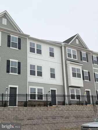 a front view of a house with glass windows