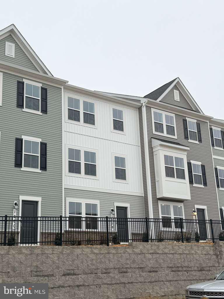 a front view of a house with glass windows