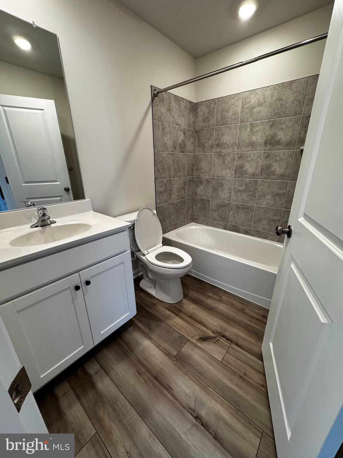 1258 Red Clover Lane Ranson, WV 25438 - Photo 15 of 25 a bathroom with a sink a toilet a mirror and shower