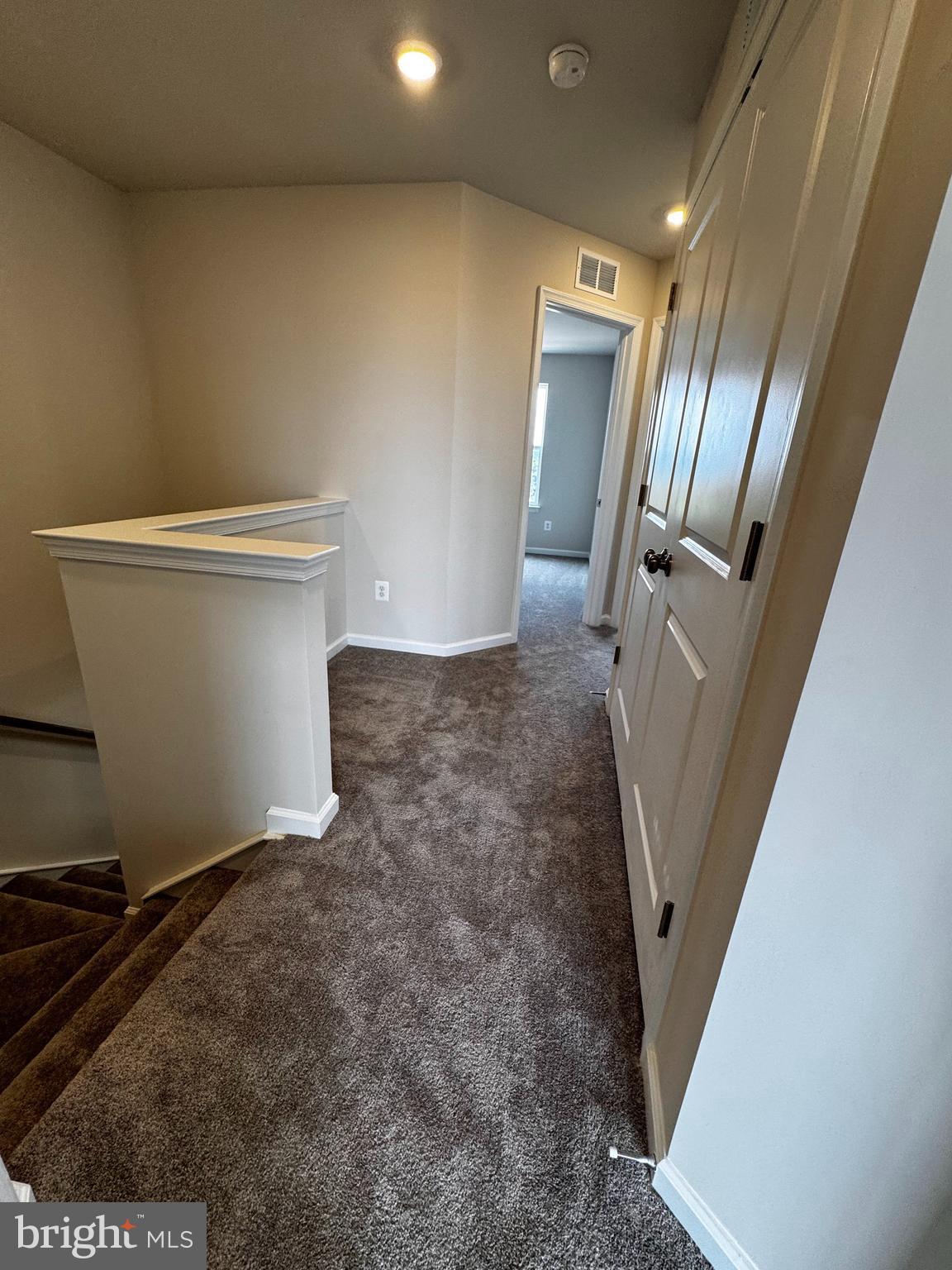 1258 Red Clover Lane Ranson, WV 25438 - Photo 17 of 25 a view of a hallway with staircase