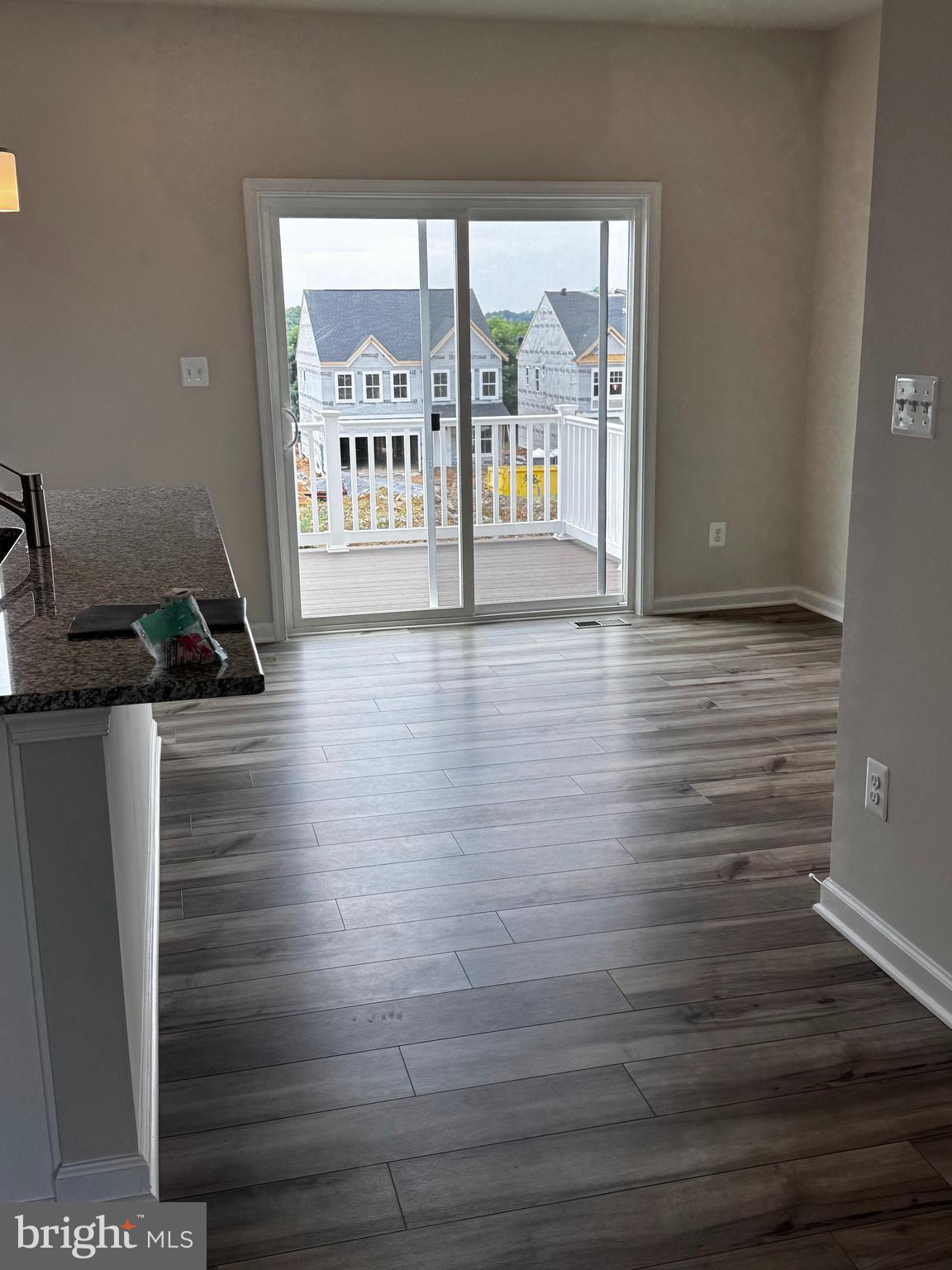 1258 Red Clover Lane Ranson, WV 25438 - Photo 23 of 25 a view of a hallway with wooden floor and seating space