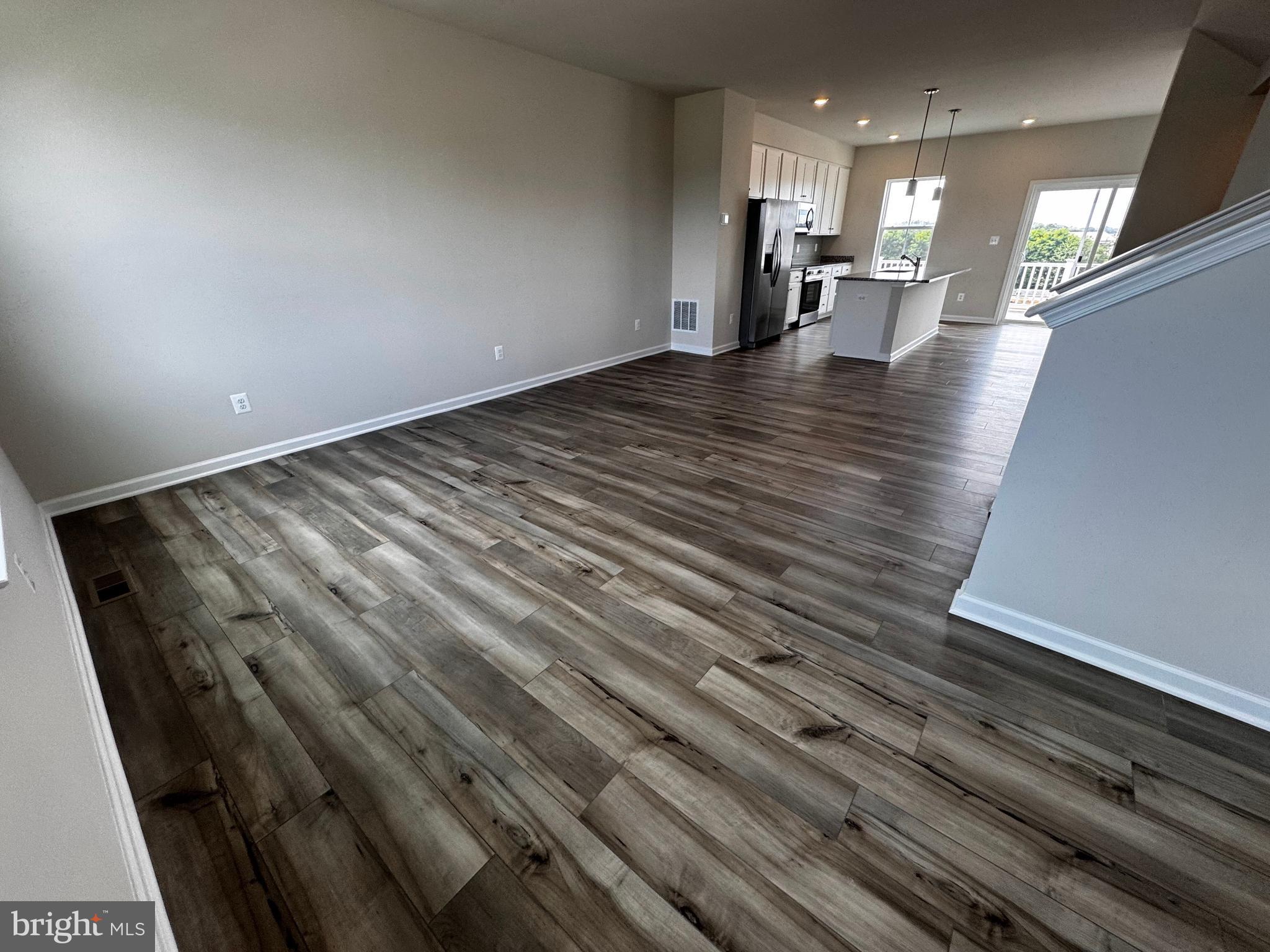 1258 Red Clover Lane Ranson, WV 25438 - Photo 24 of 25 a view of empty room with wooden floor