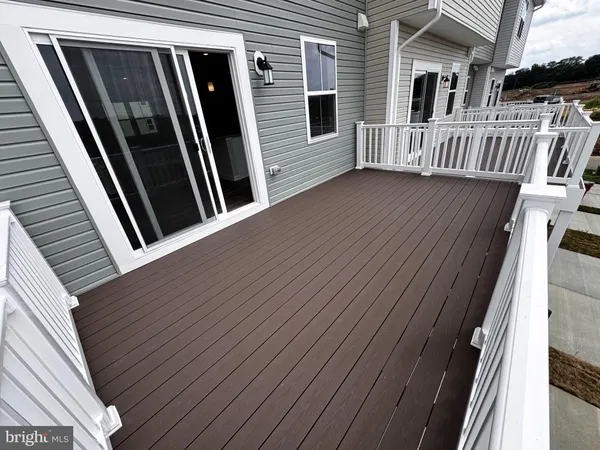 a view of kitchen with microwave and cabinets